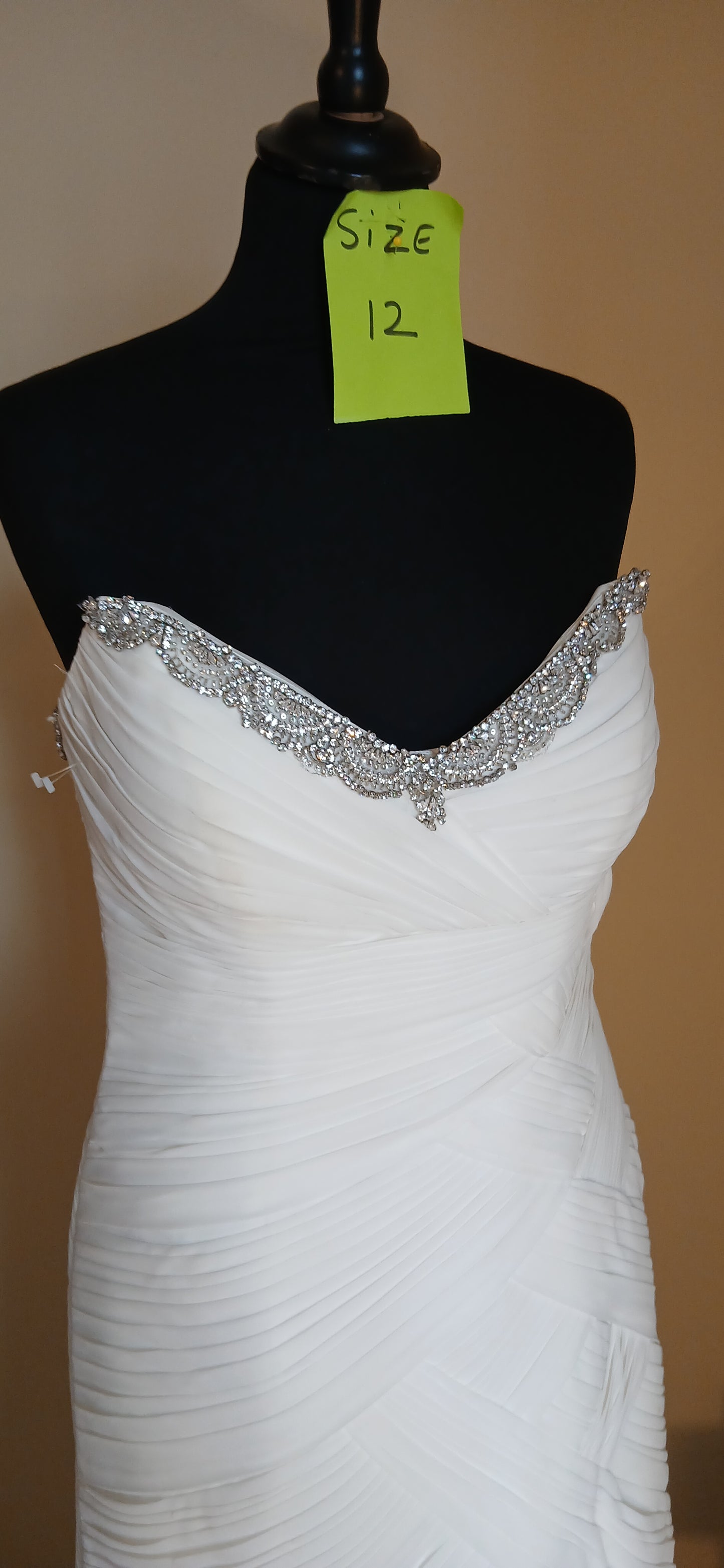 view of neckline and fitted dress