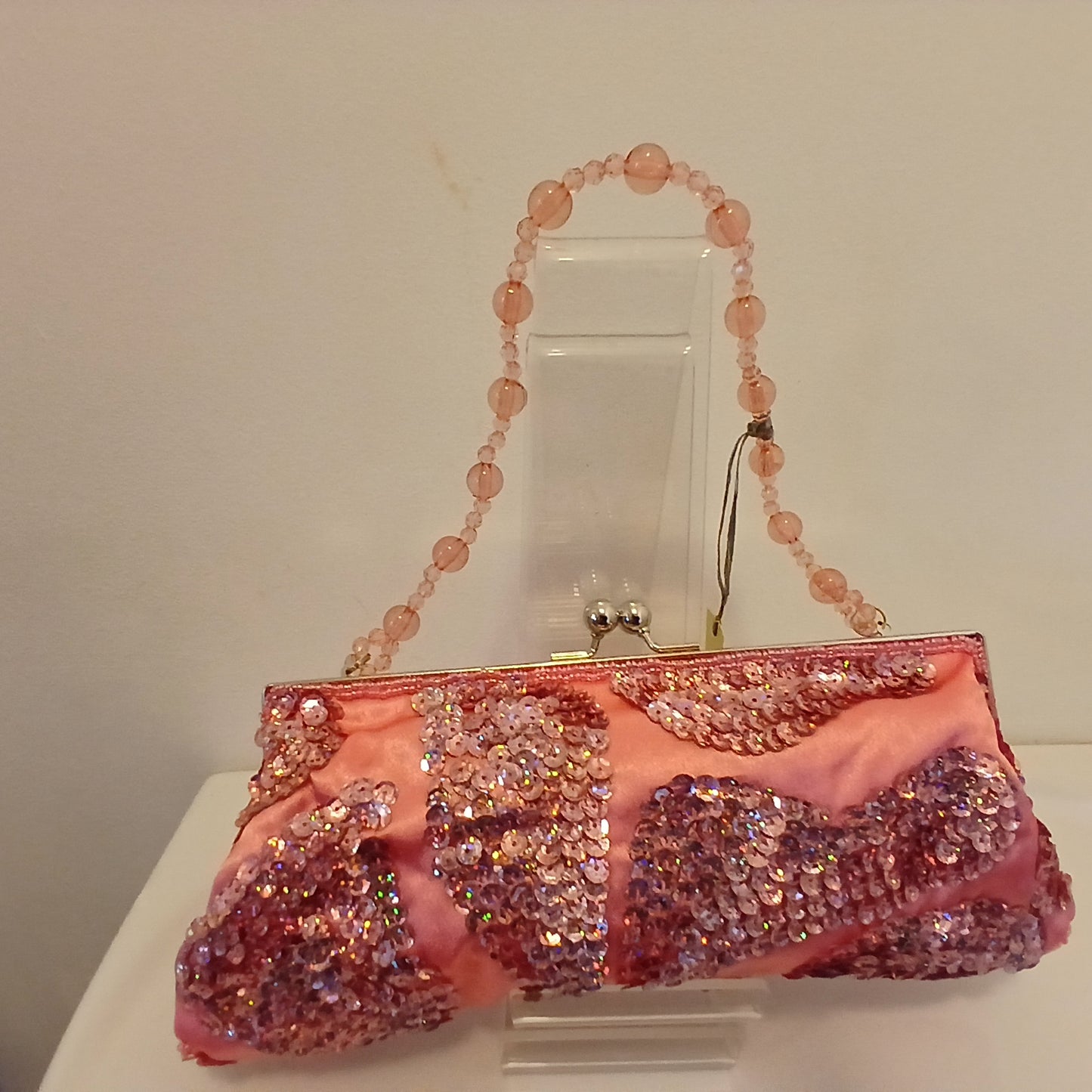 Pink sequined bag with beaded strap