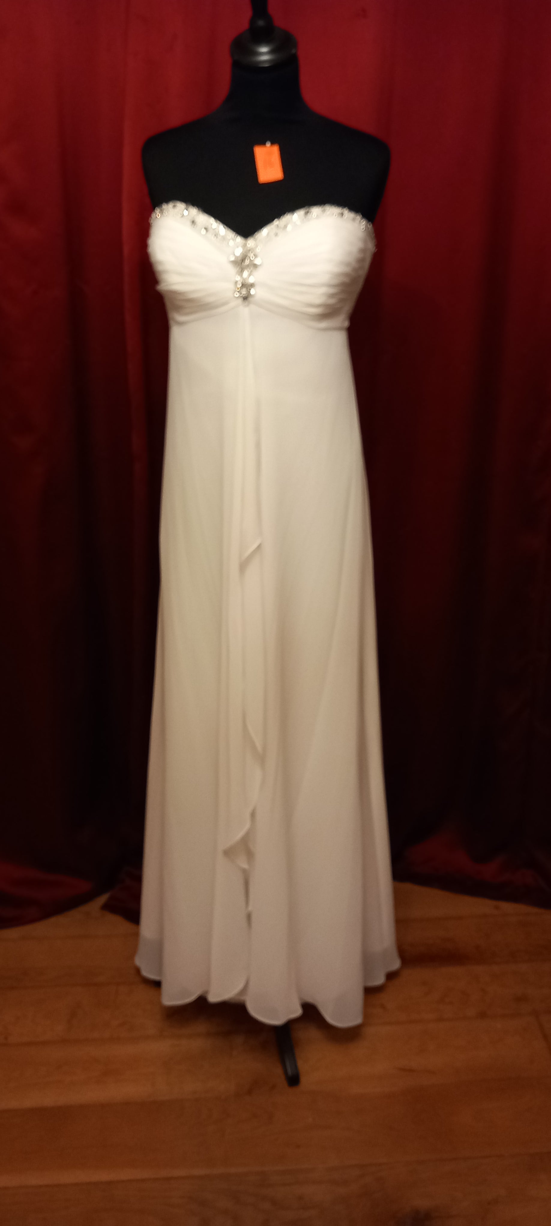  featuring a beautiful empire line design with a stunning beaded sweetheart neckline.