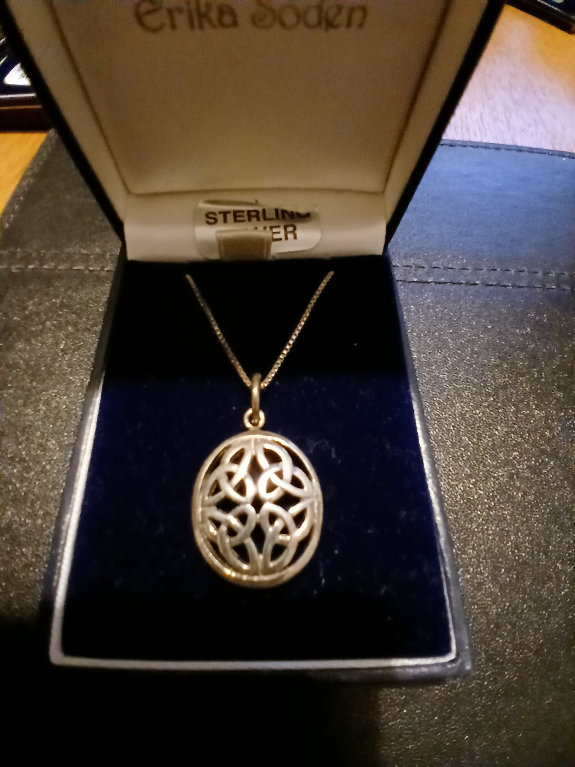 Celtic pendant featuring traditional Celtic knotwork design on sterling silver chain, authentic Irish heritage jewellery"
