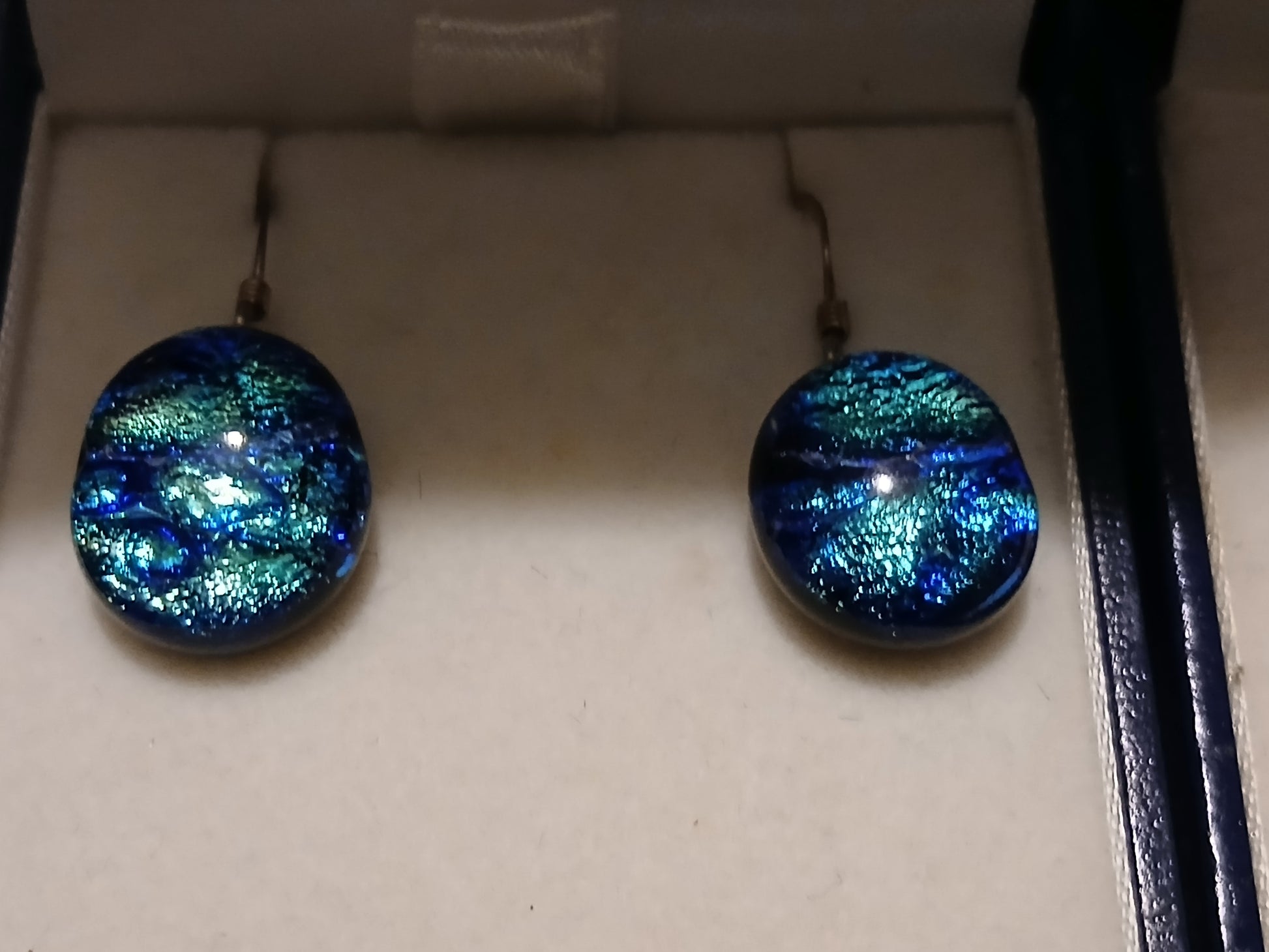 Blue ripple dichroic glass earrings featuring ocean wave-inspired ripple effects with sterling silver ear wires"