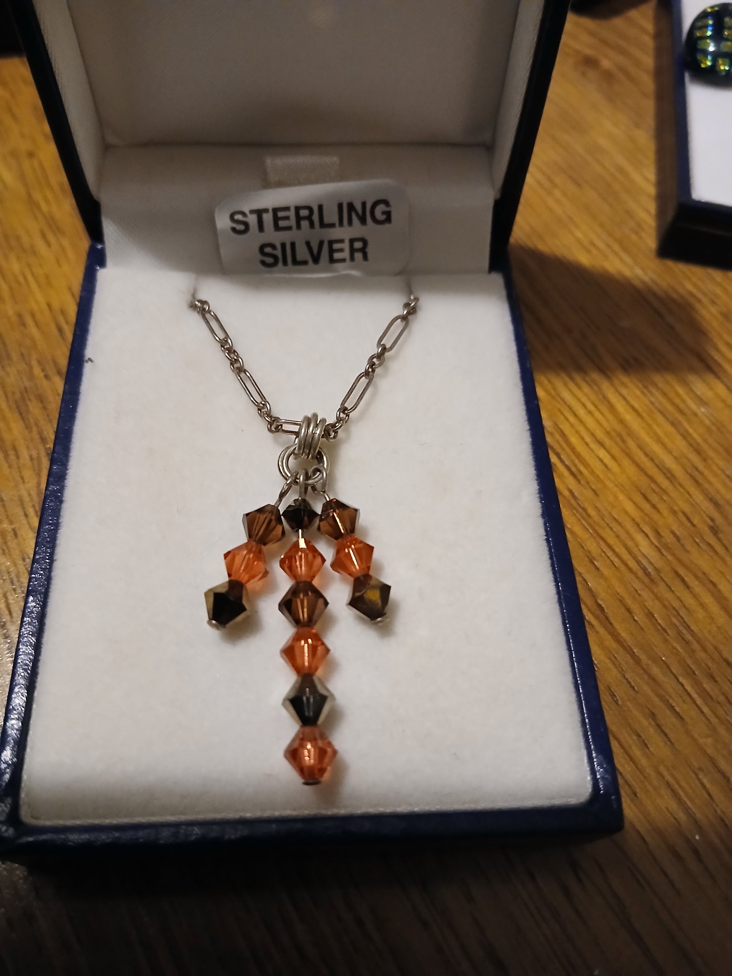 Crystal drops necklace featuring brown and orange Swarovski crystals on sterling silver 925 chain"