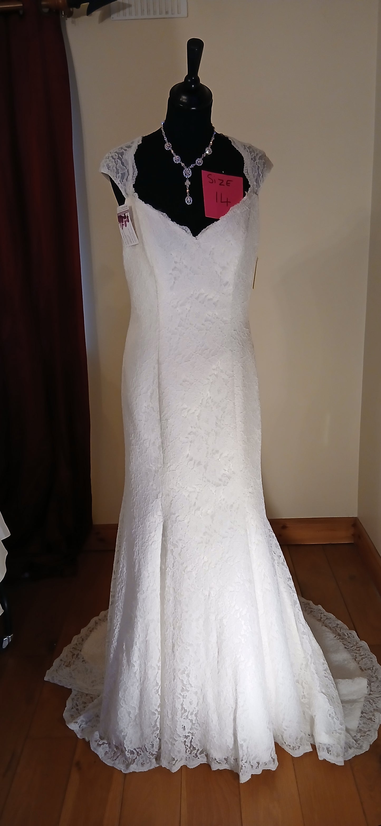 "Beautiful lace wedding dress Susanna featuring intricate lace detailing and romantic silhouette. 