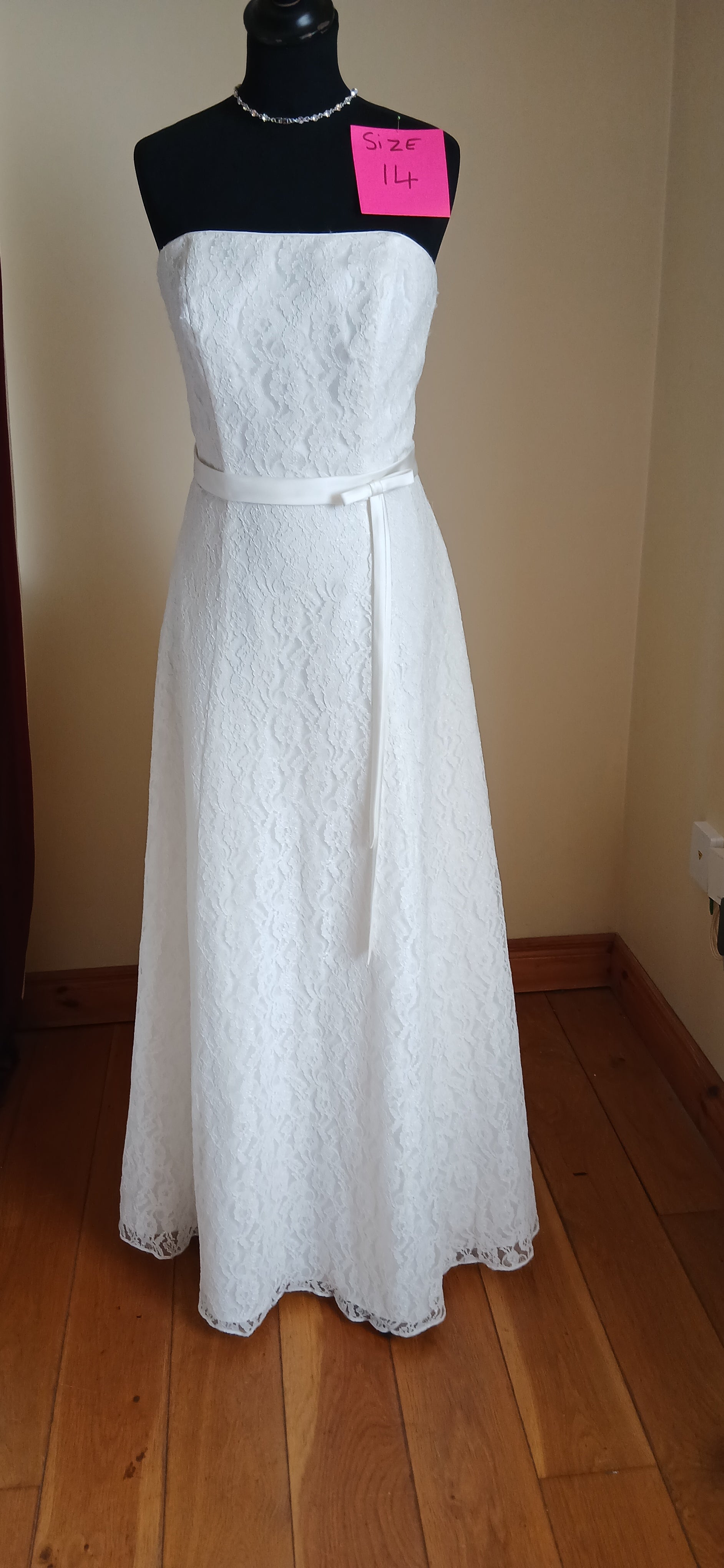Beautiful lace a line wedding dress with a corset back. No train. Size 14. Elegant and sophisticated design perfect for your special day.