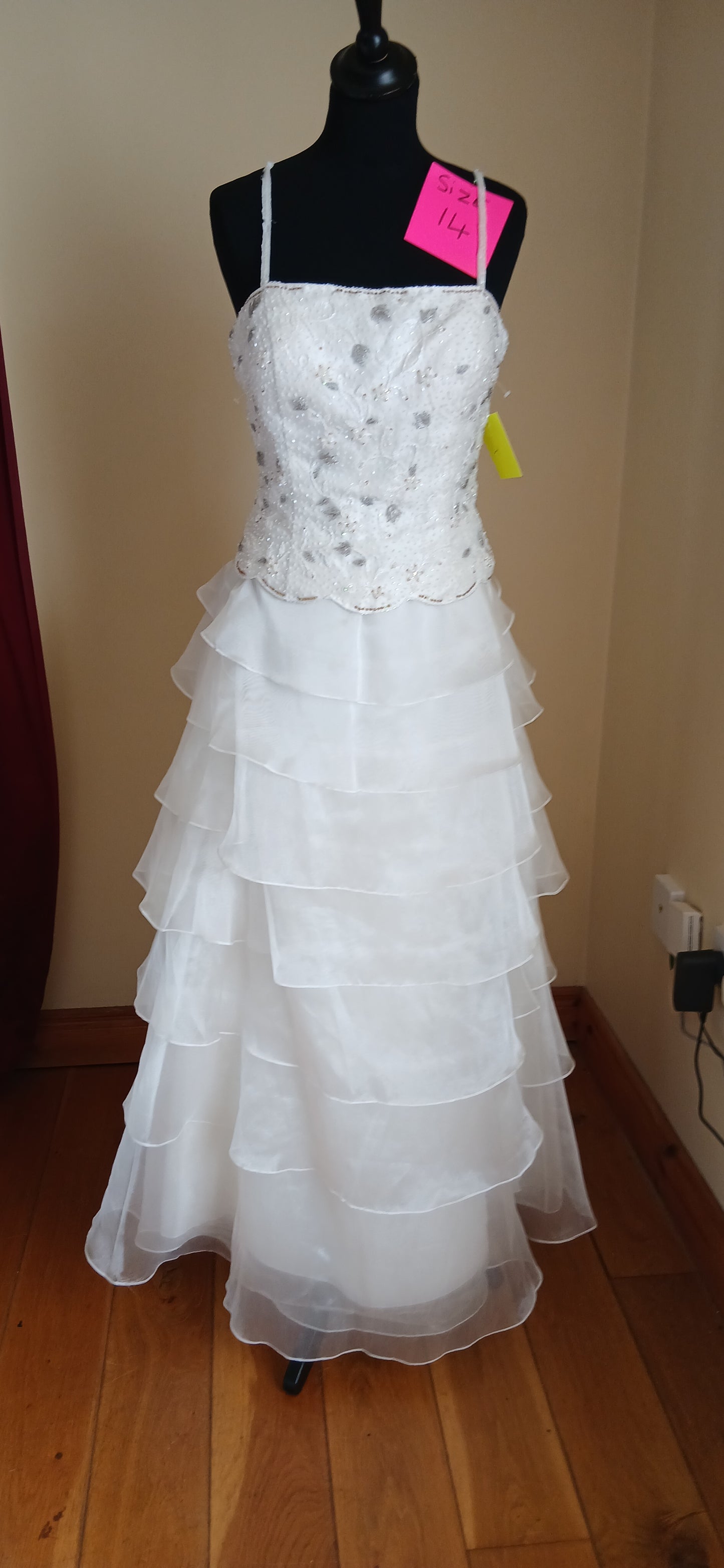  Wedding dress Chloe. This classic A-line gown features a flowing skirt and a beautifully beaded bodice with delicate spaghetti straps. 