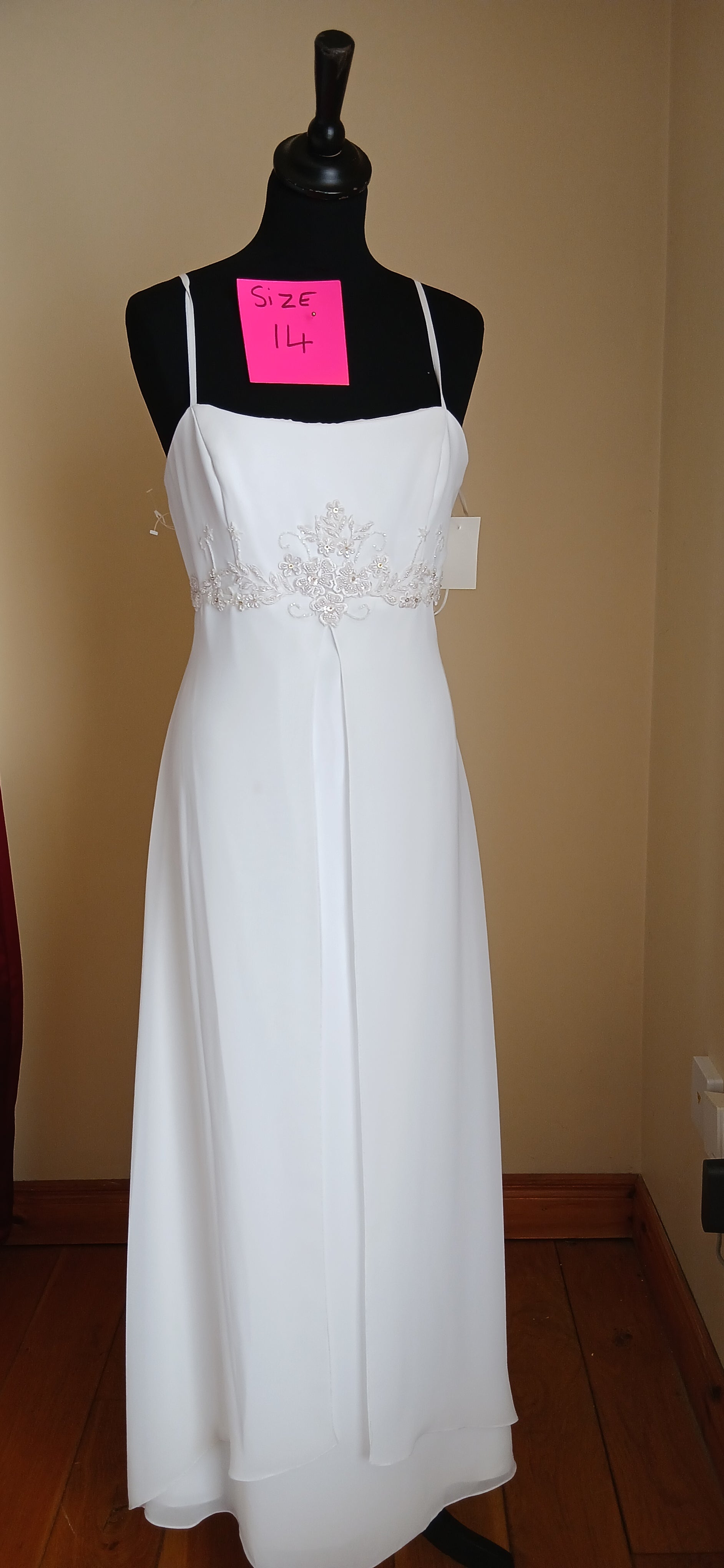 Step into the timeless world of our Wedding dress, a vintage-inspired masterpiece that exudes intricate charm and bohemian elegance. This ivory beauty, size 14, features no train, making it a perfect blend of classic and modern. The delicate beadwork adds a touch of sophistication, while the overall design whispers tales of a bygone era. It's not just a dress; it's a piece of history, a work of art, and a testament to the enduring power of love and beauty