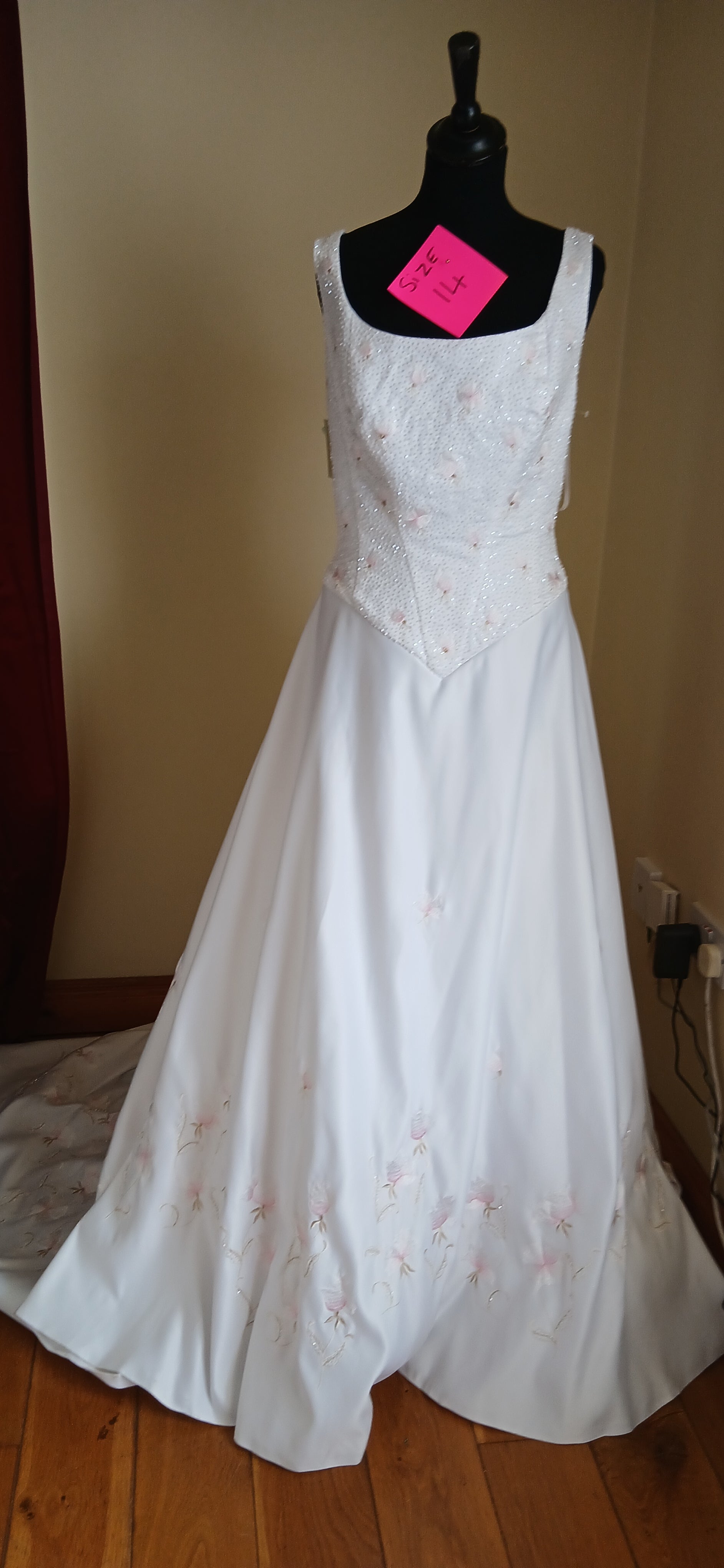  Wedding dress Regina.  delicate pink flowers embroidered along the bodice and train,