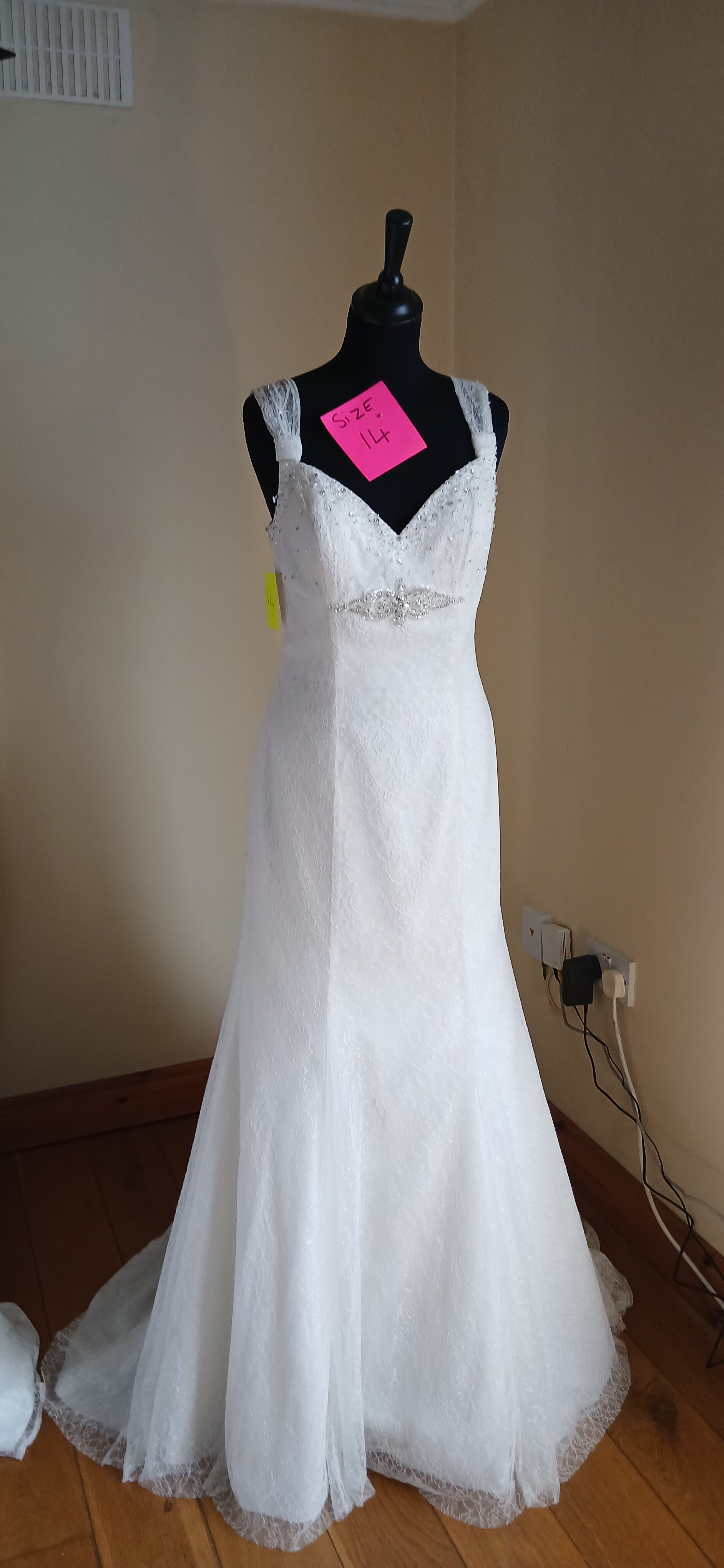  wedding dress Angela.  With its elegant silhouette and delicate details, it's the perfect blend of sophistication and  elegance