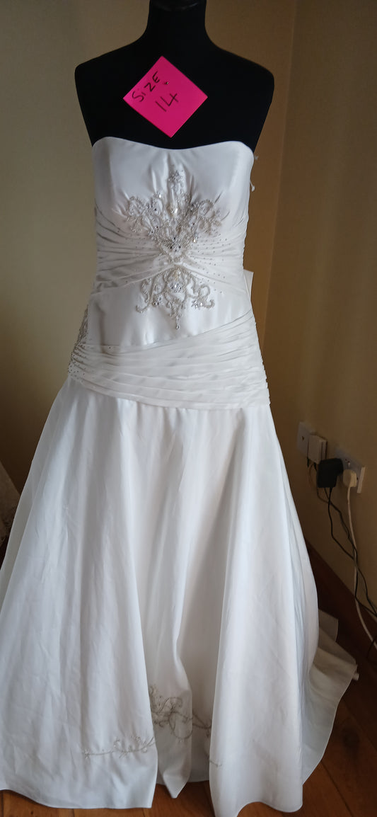 This dress features a luxurious fabric that drapes beautifully, creating a flattering silhouette. 
