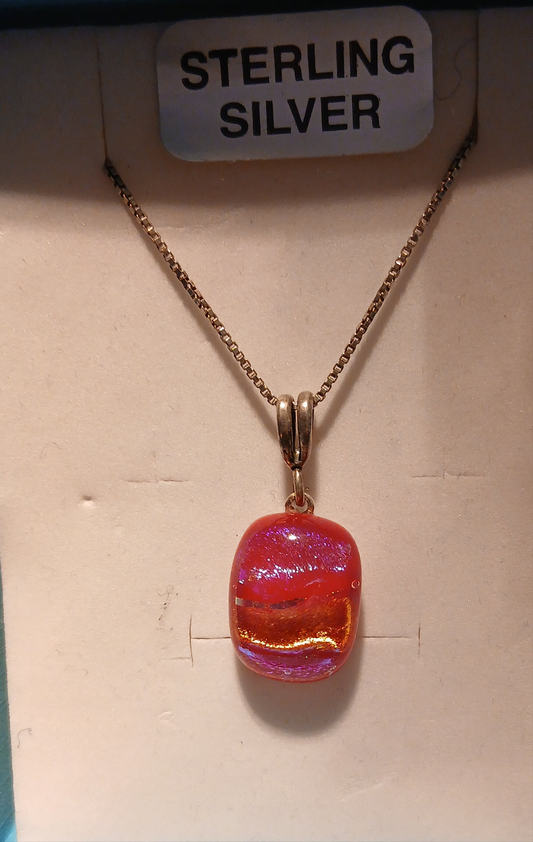 Discover the perfect introduction to dichroic glass artistry with this charming Small Dichroic Pendant that proves beautiful things truly do come in small packages. This delicate handcrafted piece showcases the mesmerizing color-shifting properties of dichroic glass in a perfectly proportioned pendant that's ideal for everyday elegance.

Created in my own kiln using traditional glass fusing techniques, this small pendant captures light and transforms it into a captivating display of shifting colours