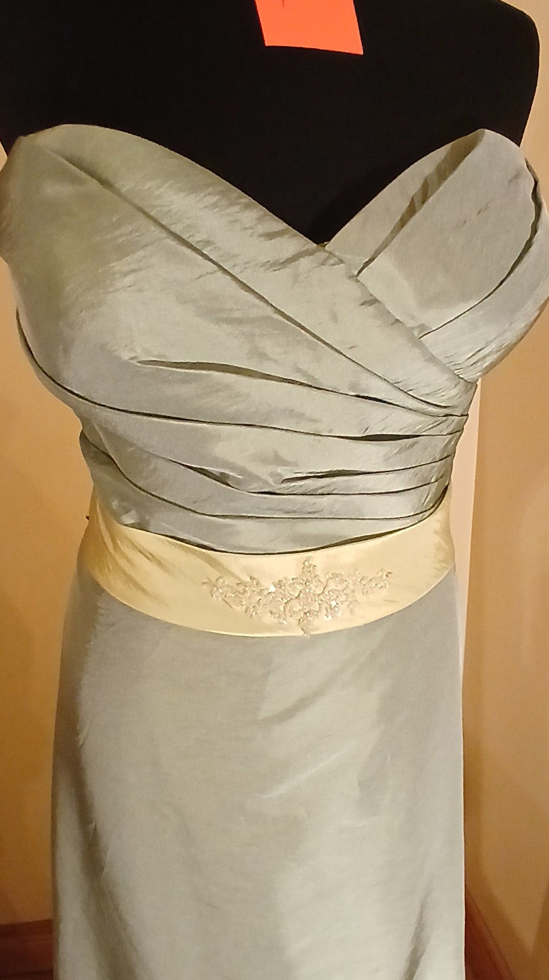 Green taffeta dress size 18 with attached waistband, beaded motif and train