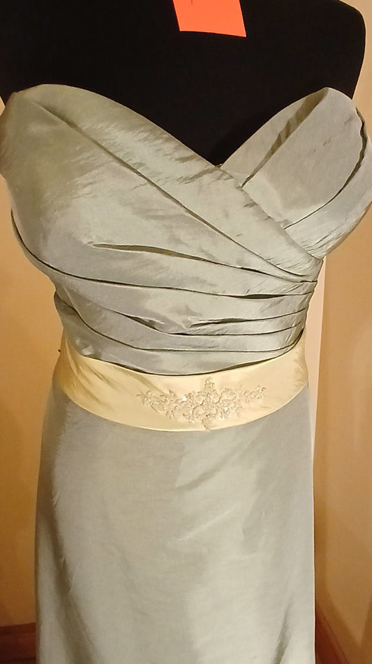 Green taffeta dress size 18 with attached waistband, beaded motif and train