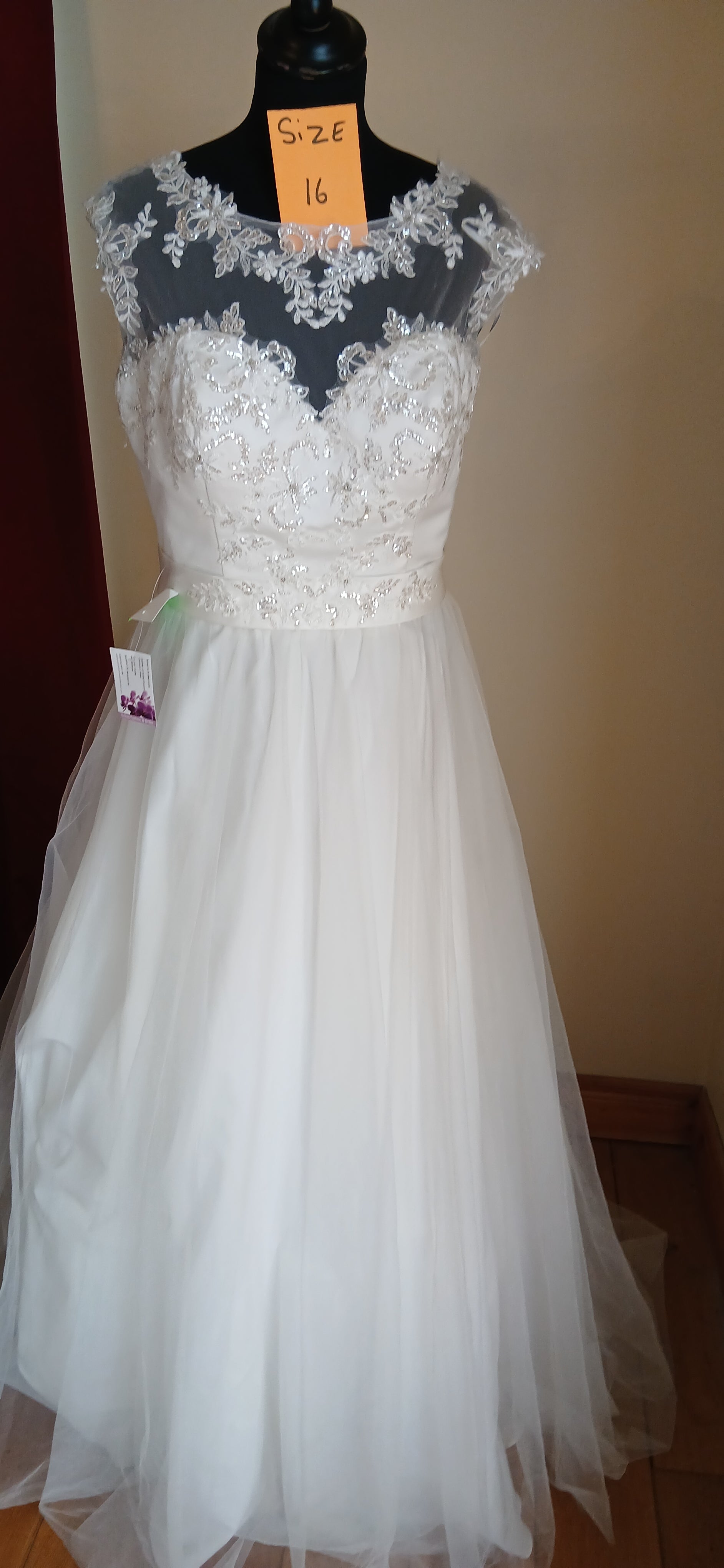  Wedding Dress Rachael size 16 ivory  features a beautiful beaded bodice that sparkles like diamonds in the light, paired with a full ballgown skirt