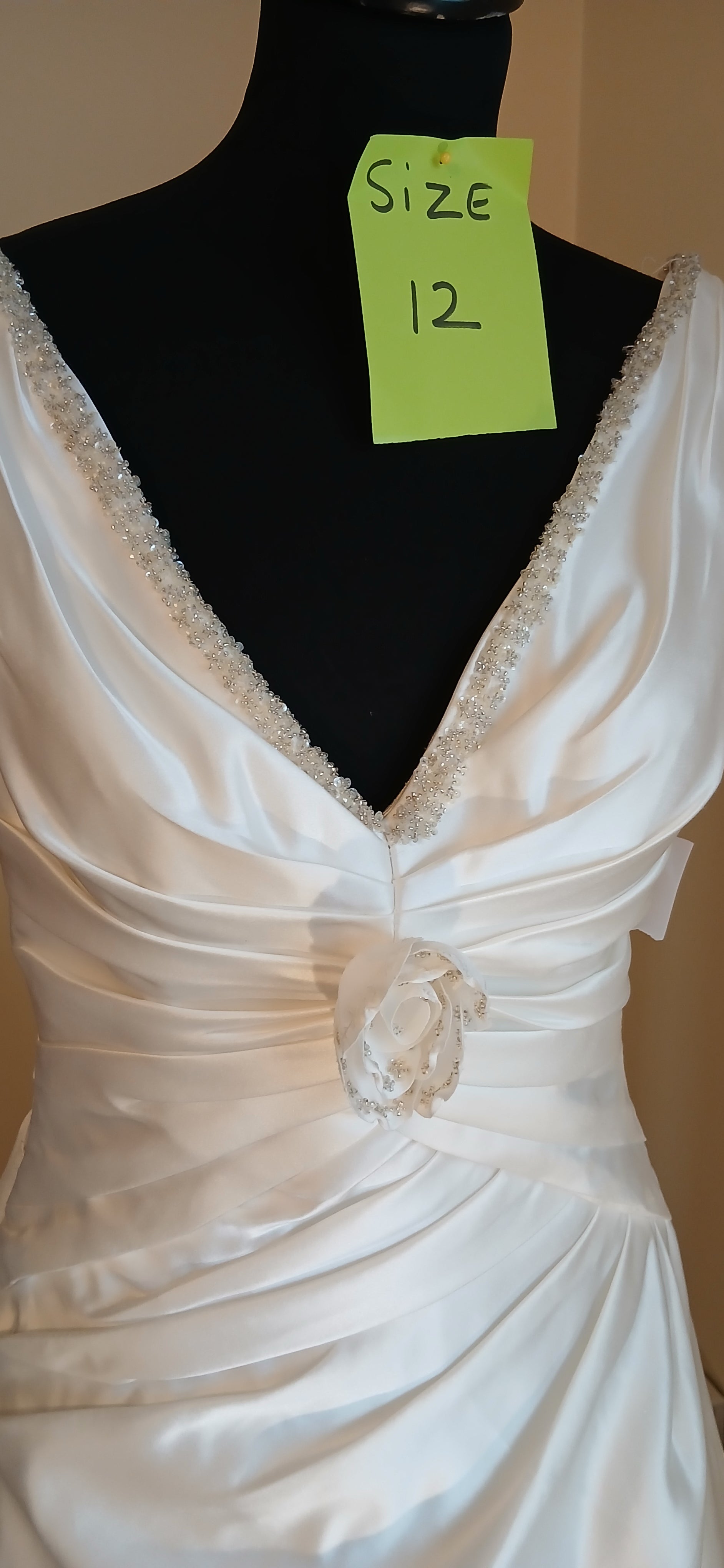 Beautiful v neck with beaded detail and fabric rose