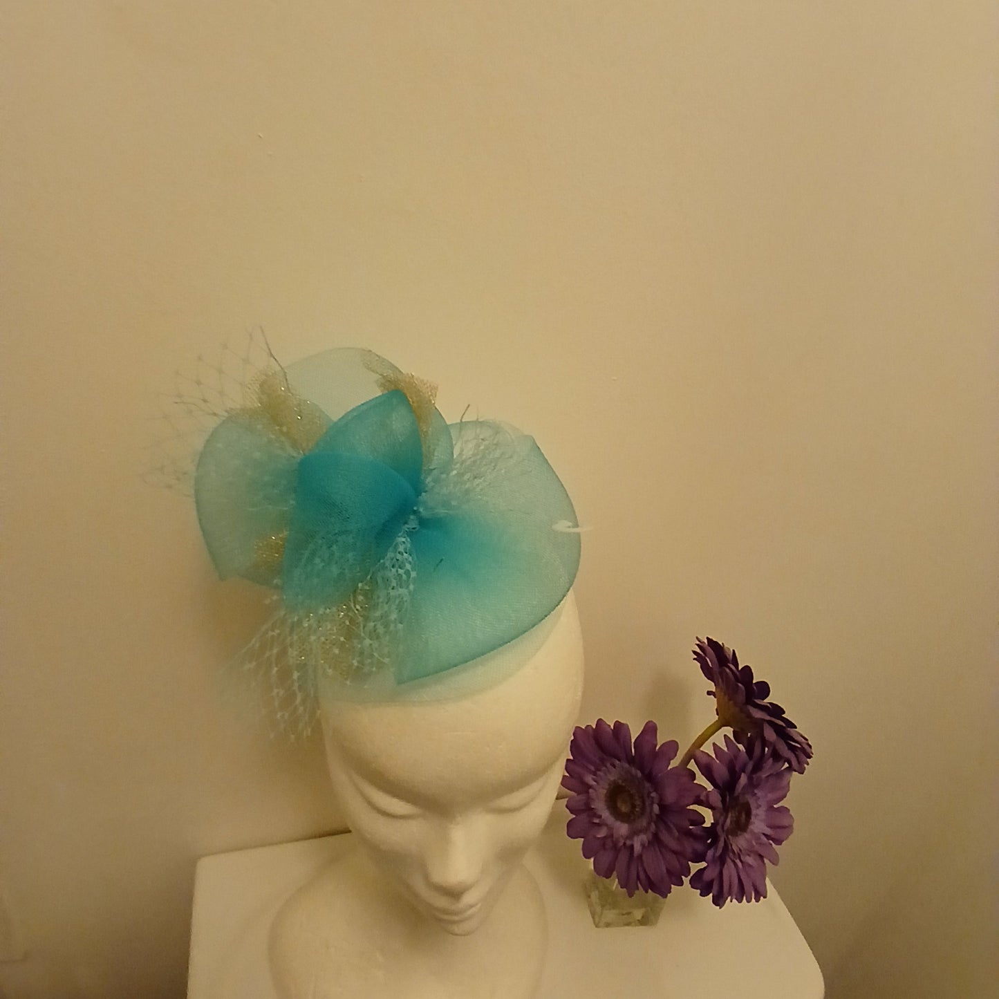 Fascinator rama in  turquoise bow style  turquoise and  gold