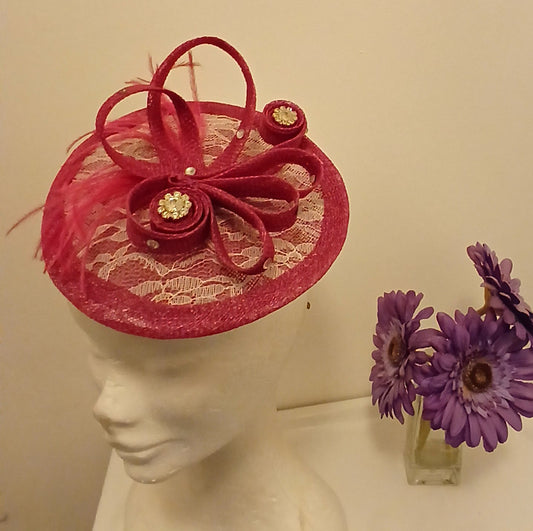 Facinator  Innga in  cerise with white lace and diamonte crystal centrepiece