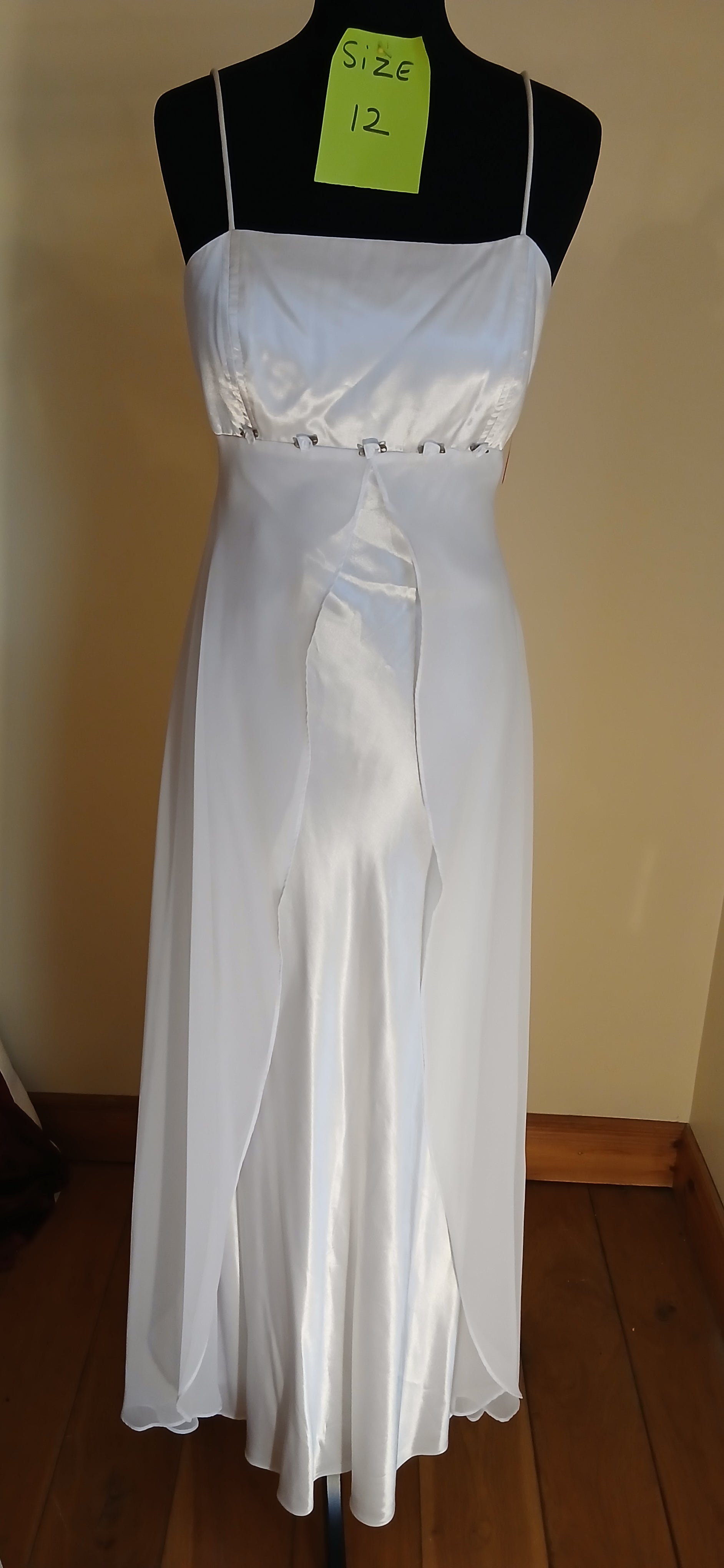 This exquisite wedding dress is a size 10/12,  Don't miss out on this amazing opportunity to wear your dream dress!