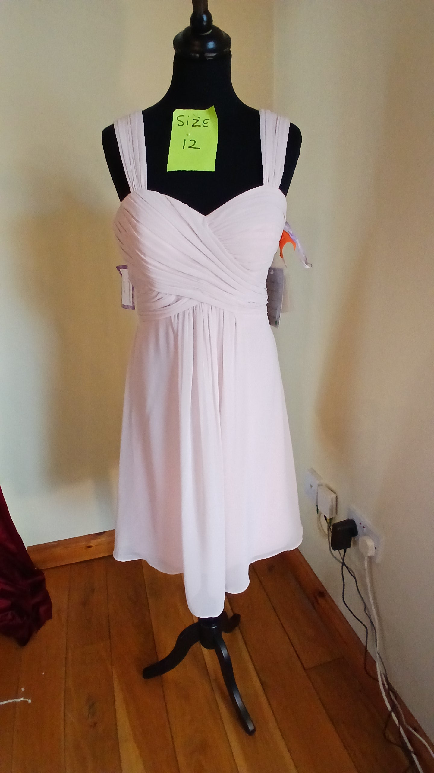 Baby pink size 12  chiffon dress with wide straps , knee length, one of our clearance sale dresses so grab a bargain