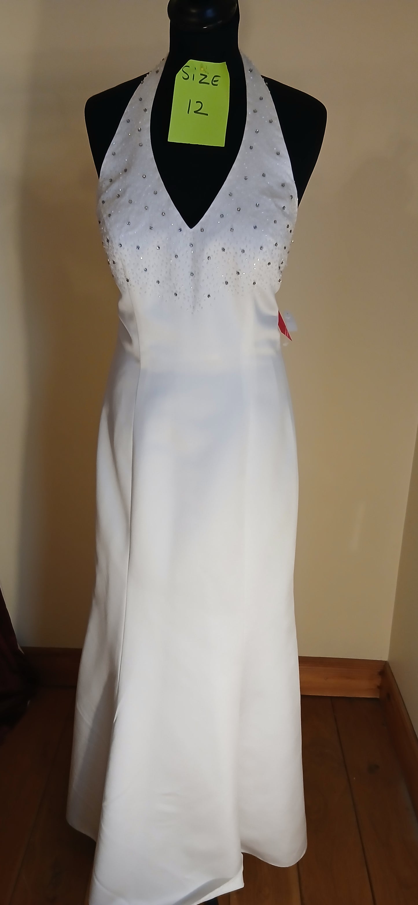  It features beautiful beaded diamond details on bust and  down the train, 