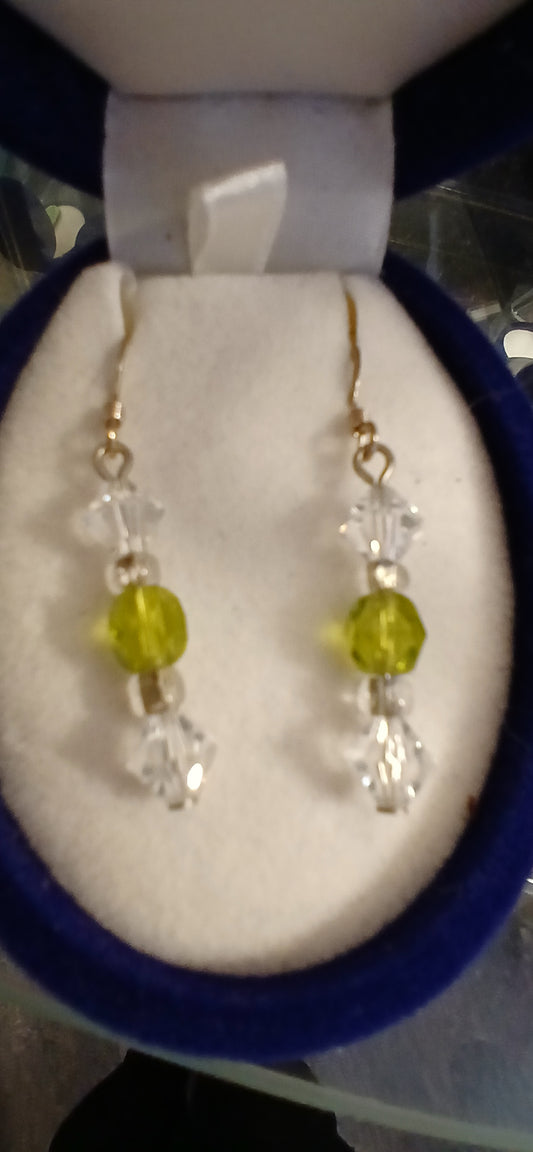 Experience the luxury of our Swarovski crystals and Czech glass in peridot earrings. These elegant earrings feature sterling silver ear wires and a stunning peridot design. Perfect for those who appreciate high-quality craftsmanship and unique, eye-catching jewellery.