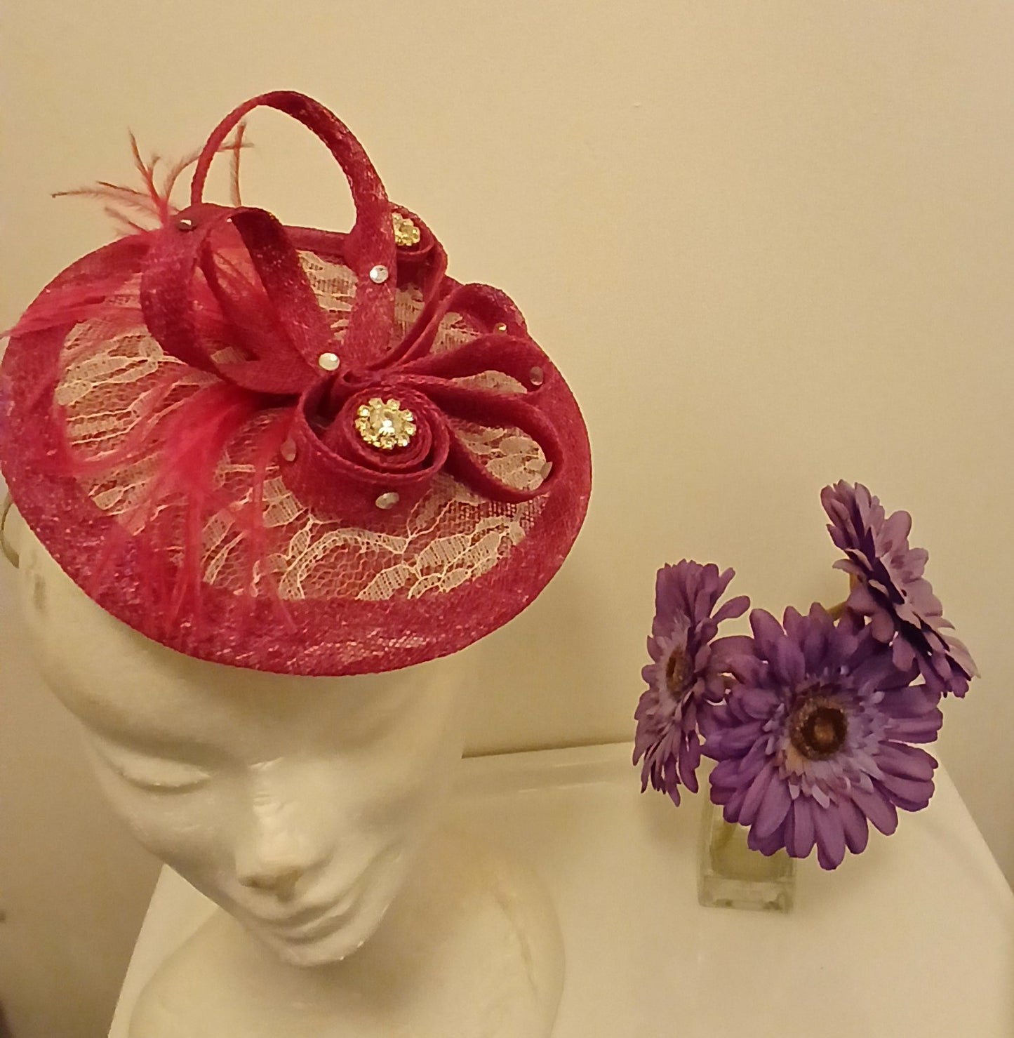 Facinator  Innga in  cerise with white lace and diamonte crystal centrepiece