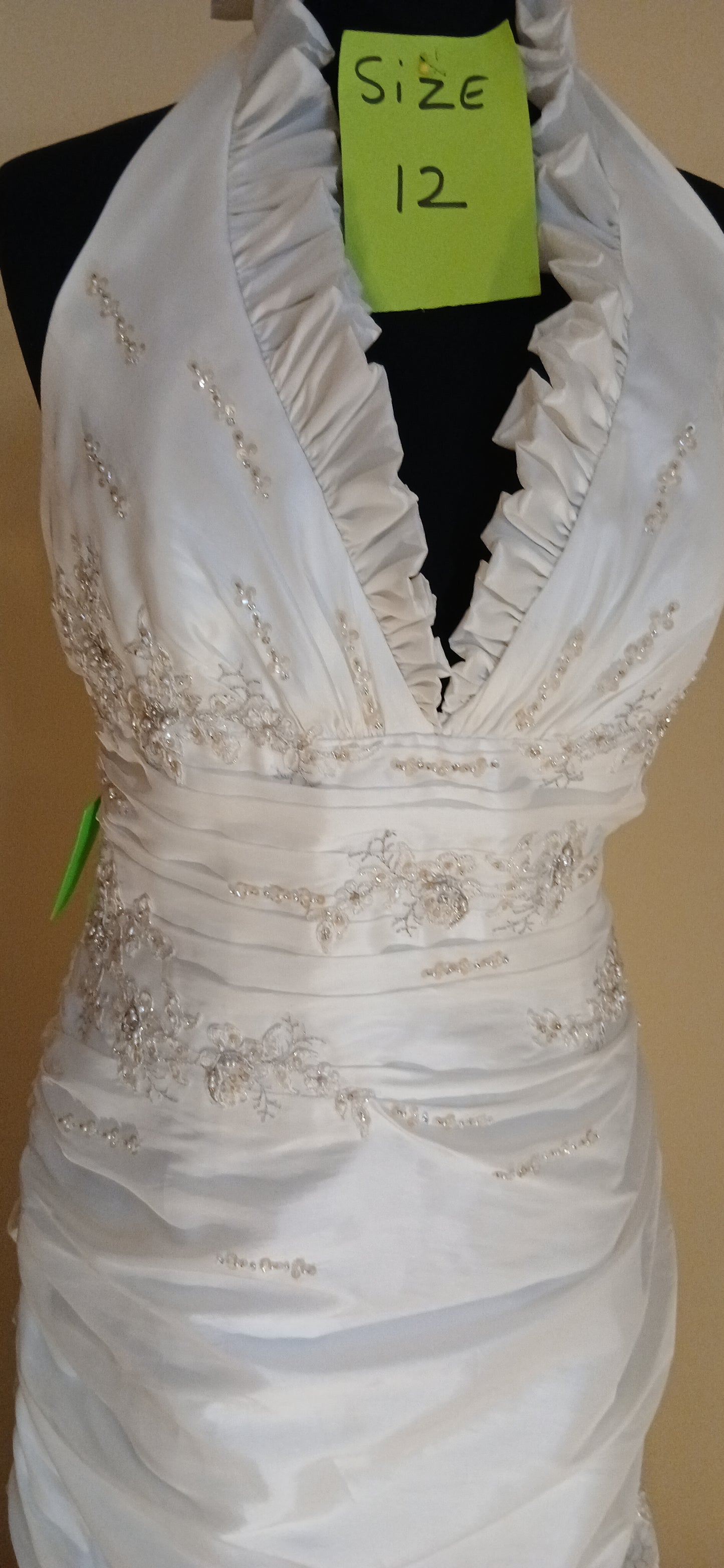 frilled neckline  fitted waist
