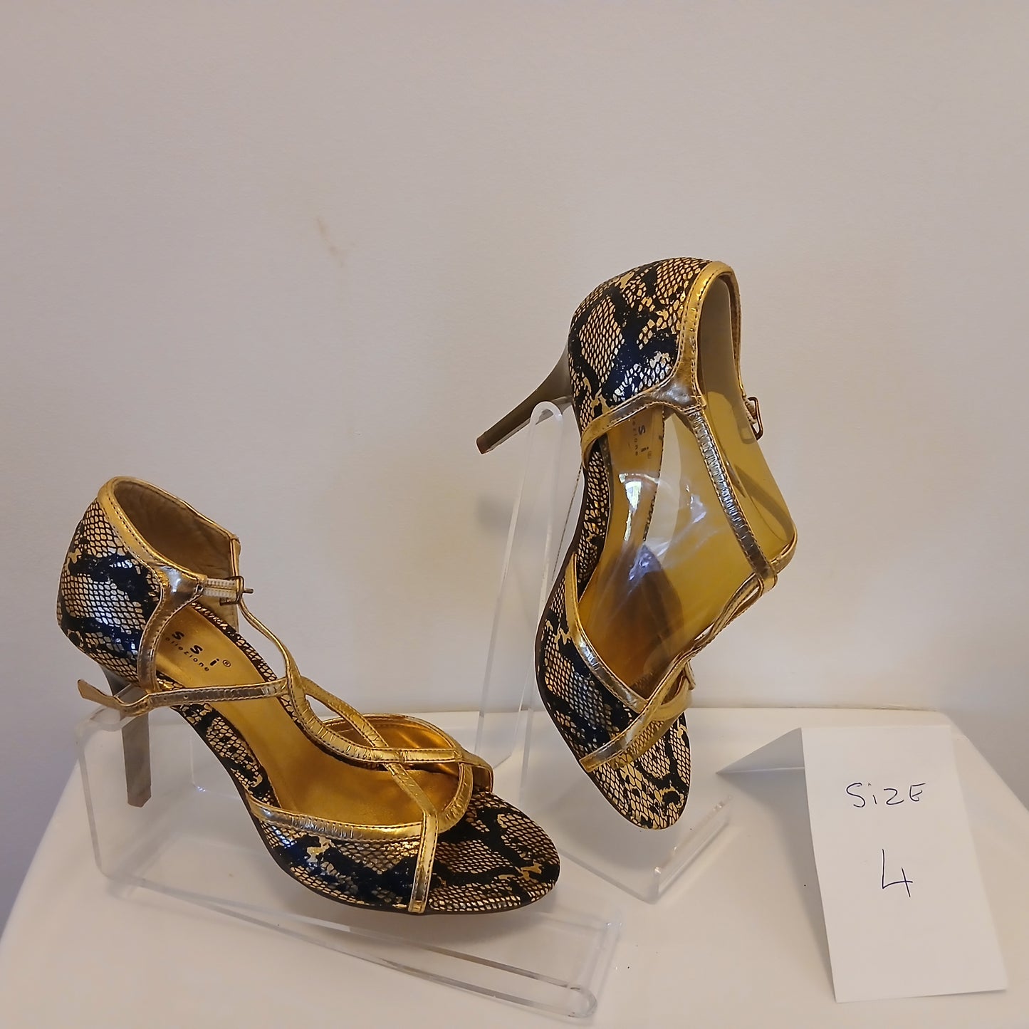 Gold and black sandal size 4