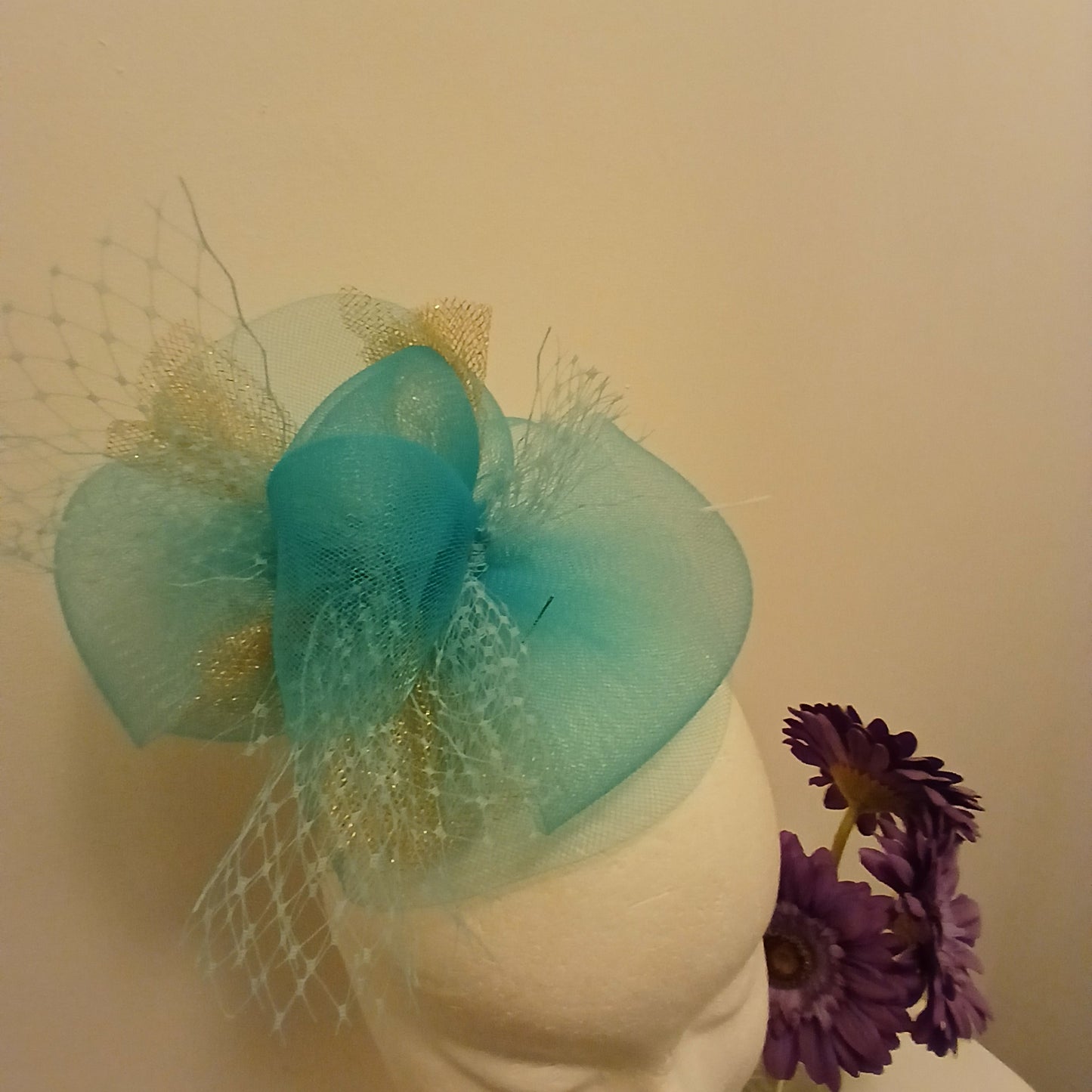 Fascinator rama in  turquoise bow style  turquoise and  gold
