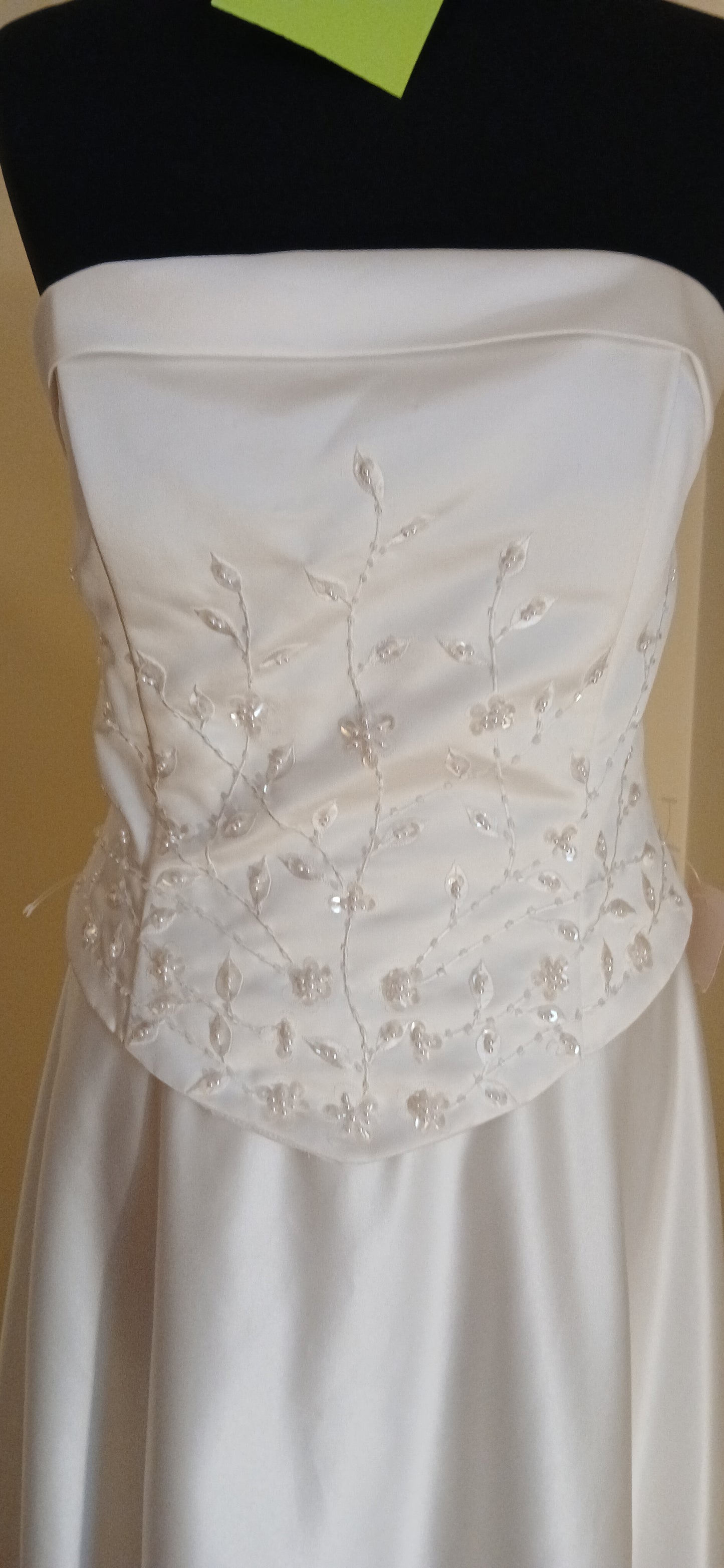 This exquisite wedding dress is a size 12 in ivory