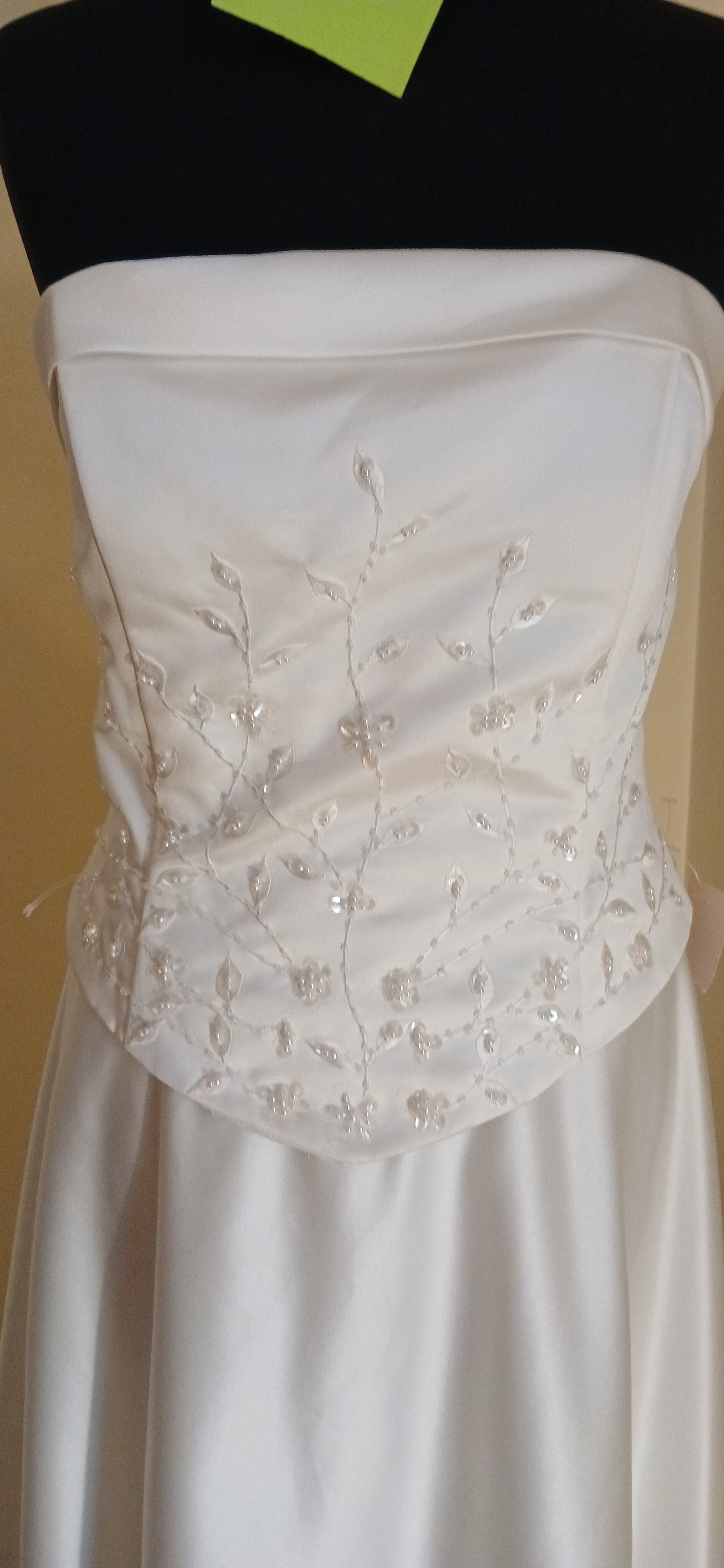 This exquisite wedding dress is a size 12 in ivory