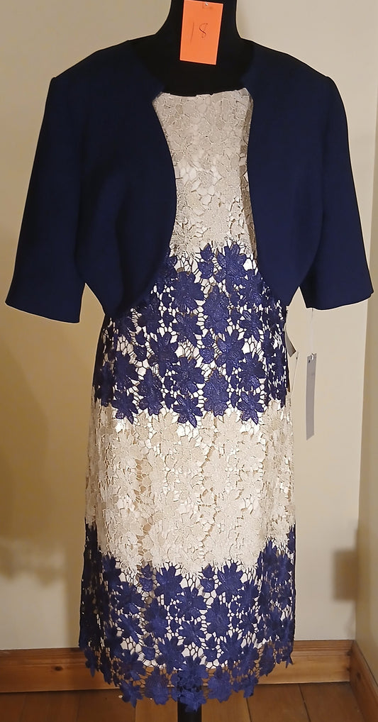 our exquisite Mother of Bride and Groom outfit. This size 18 ensemble features a stunning gold and navy floral lace dress, perfectly complemented by a navy bolero jacket with delicate scalloped details. 